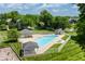 Community pool featuring multiple covered gazebos, seating areas, and a playground nearby at 15920 Oak Park Ct, Westfield, IN 46074