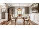 Stylish dining room featuring a bay window, classic hutch, and an oval wood dining table at 15920 Oak Park Ct, Westfield, IN 46074
