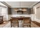 Traditional dining room with wainscoting, stylish lighting, and beautiful dark wood table at 15920 Oak Park Ct, Westfield, IN 46074