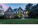 Charming two-story brick home with a well-manicured lawn, landscaping, and inviting front entrance at 15920 Oak Park Ct, Westfield, IN 46074