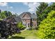 Stately brick home with lush green surroundings and a well-maintained lawn at 15920 Oak Park Ct, Westfield, IN 46074