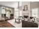 Sophisticated living room with high ceilings, a fireplace, and stylish seating at 15920 Oak Park Ct, Westfield, IN 46074