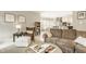 Cozy living room with comfortable seating, decorative accents, and an open layout to the kitchen at 15920 Oak Park Ct, Westfield, IN 46074
