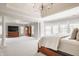 Spacious main bedroom with columns, sitting area, tray ceilings, and lots of natural light at 15920 Oak Park Ct, Westfield, IN 46074