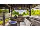 Entertainer's outdoor kitchen featuring a fire pit, seating, grill, and cozy ambiance at 15920 Oak Park Ct, Westfield, IN 46074