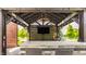 Outdoor kitchen featuring a bar, grill, television, lighting, and view of the backyard at 15920 Oak Park Ct, Westfield, IN 46074