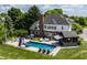 Backyard oasis with a large in-ground pool, slide, hot tub and outdoor bar area at 15920 Oak Park Ct, Westfield, IN 46074