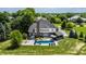 Backyard with a pool, slide, hot tub, outdoor bar, and plenty of space for entertaining at 15920 Oak Park Ct, Westfield, IN 46074