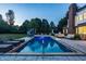 Inviting backyard pool with lounge chairs and a slide for summer fun at 15920 Oak Park Ct, Westfield, IN 46074