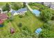 Aerial view showcasing home's location with a deck, outbuilding and generous lawn at 1624 Riley Rd, Lebanon, IN 46052