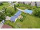 Aerial shot of home and property, showcasing backyard deck and outbuilding at 1624 Riley Rd, Lebanon, IN 46052