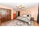 Spacious bedroom featuring hardwood floors, ceiling fan, and a large closet with decor shelves at 1624 Riley Rd, Lebanon, IN 46052