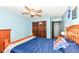 Comfortable bedroom with a ceiling fan, wood closet doors, and an open doorway at 1624 Riley Rd, Lebanon, IN 46052
