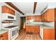 Well-lit kitchen with wooden cabinets, modern appliances, and wood-look flooring at 1624 Riley Rd, Lebanon, IN 46052