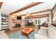 Open living space with brick fireplace, wood beams and dining area at 1624 Riley Rd, Lebanon, IN 46052