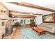 Spacious living area featuring a brick fireplace, hardwood floors, and a comfortable seating arrangement at 1624 Riley Rd, Lebanon, IN 46052