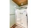 Modern shower with glass door, built-in seat, and organized shelving for toiletries at 1624 Riley Rd, Lebanon, IN 46052