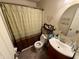 Bathroom with a shower, stylish sink, and well-lit vanity area at 1816 Hemlock Ln, Plainfield, IN 46168