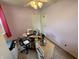 Cozy bedroom with sewing station, storage drawers, and soft carpet flooring at 1816 Hemlock Ln, Plainfield, IN 46168