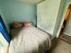 Small bedroom with a window, closet, and comfortable bed at 1816 Hemlock Ln, Plainfield, IN 46168