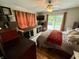 Comfortable bedroom with a queen bed, ceiling fan, outdoor access, and natural light at 1816 Hemlock Ln, Plainfield, IN 46168
