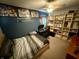 Bedroom with a desk, built-in shelves, and comfortable bed at 1816 Hemlock Ln, Plainfield, IN 46168