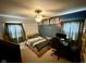 Bedroom with a desk, built-in shelves, and comfortable bed at 1816 Hemlock Ln, Plainfield, IN 46168