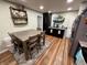 An eat-in kitchen space with modern appliances, ample cabinetry, and a dining table, complemented by light green walls at 1816 Hemlock Ln, Plainfield, IN 46168