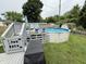 Grassy backyard features an above ground pool, privacy fence, and small sheds at 1816 Hemlock Ln, Plainfield, IN 46168