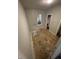 Small bedroom featuring hardwood flooring, light-colored walls, and a window boarded up at 1902 Orange St, Indianapolis, IN 46203