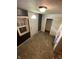 The entryway boasts a new door, a side window, and access to an adjacent room at 1902 Orange St, Indianapolis, IN 46203