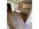 Kitchen featuring a view of the next room, white cabinets, and tile floors at 1902 Orange St, Indianapolis, IN 46203