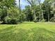 Peaceful wooded backyard with lush greenery offering complete privacy and a quiet ambiance at 1980 S Arthur Rd, Paragon, IN 46166