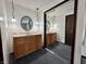 Bathroom with double vanities and a large mirrored closet, offering plenty of space and style at 1980 S Arthur Rd, Paragon, IN 46166