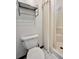 Cozy bathroom with a toilet, shower and chrome shelving for convenient storage space at 1980 S Arthur Rd, Paragon, IN 46166