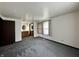 Carpeted bedroom features an ensuite bathroom and natural light at 1980 S Arthur Rd, Paragon, IN 46166