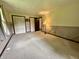 A bedroom with ample closet space and neutral carpeting, offering a blank canvas at 1980 S Arthur Rd, Paragon, IN 46166