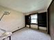 Cozy bedroom featuring built-in shelving and a window providing natural light at 1980 S Arthur Rd, Paragon, IN 46166