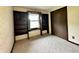 Cozy bedroom with built-in bookshelves, a window seat, and a closet, offering ample storage space at 1980 S Arthur Rd, Paragon, IN 46166