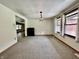 Dining room with carpeted floor, bright windows and modern light fixture at 1980 S Arthur Rd, Paragon, IN 46166