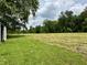 Extensive grassy field, partly cut, with trees, and small structure to the left at 1980 S Arthur Rd, Paragon, IN 46166