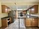 Well-lit kitchen with ample cabinet space, stainless steel appliances, and a functional layout at 1980 S Arthur Rd, Paragon, IN 46166
