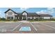 Community clubhouse with ample parking, accessible entrance, and manicured landscaping at 235 Highland Ave, Danville, IN 46122