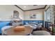 Cozy game room features tables, chairs, and natural light for relaxing and socializing at 235 Highland Ave, Danville, IN 46122