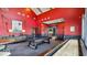 The lively game room offers a pool table, shuffleboard, and cozy seating for fun and relaxation at 235 Highland Ave, Danville, IN 46122
