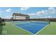 Community pickleball courts with nets, providing a fun recreational activity for residents next to clubhouse at 235 Highland Ave, Danville, IN 46122