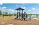 Community playground with swings and slide, perfect for families with children; it also has lake views at 235 Highland Ave, Danville, IN 46122