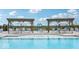 Gathering-friendly community pool with shade structures and a play area at 235 Highland Ave, Danville, IN 46122