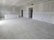 Large unfinished room with recessed lighting and several doorways at 235 Highland Ave, Danville, IN 46122