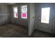 Unfinished room featuring bright windows and door to the exterior at 235 Highland Ave, Danville, IN 46122